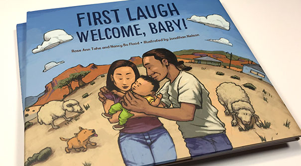 photo of First Laugh Welcome Baby front cover, a children's/picture book